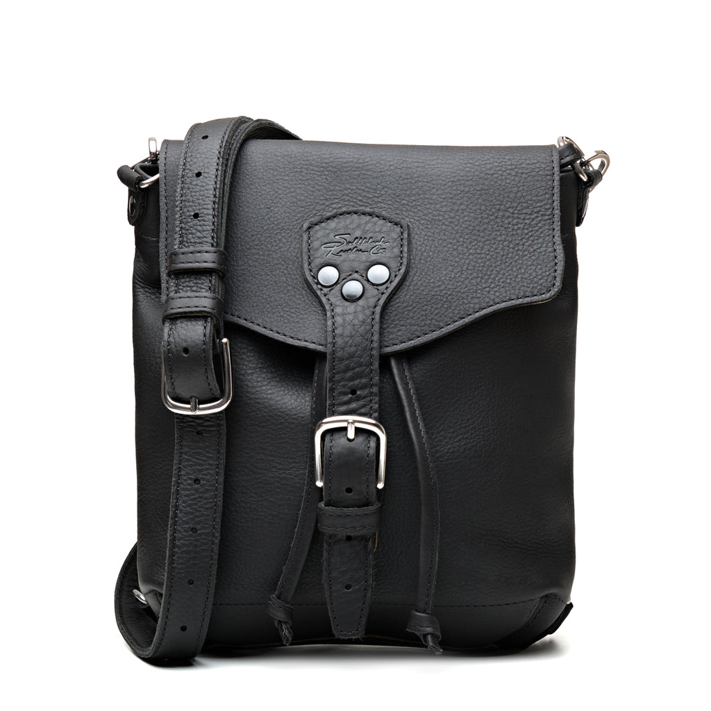 10" Convertible Crossbody in Black, front view with buckled flap, drawstring ties and strap