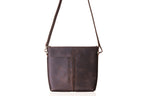 Minimal Leather Bag in dark brown, front view with two slip pockets and adjustable crossbody strap