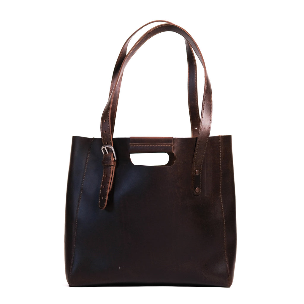 Everyday Leather Tote in Dark Coffee Brown, back view with shoulder handles, cutout grip and buckled side strap
