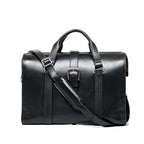 Spurgeon Briefcase in Raven Black, front view with center buckle strap, top handles and shoulder strap