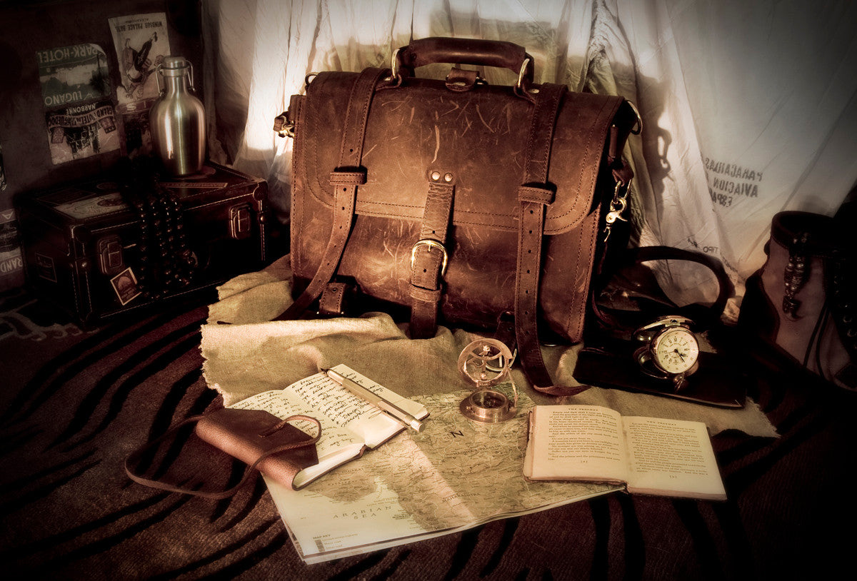Large Classic Leather Briefcase in a sepia-toned scene with old maps, open books, a clock and a compass