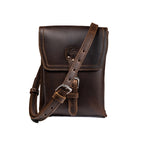 Leather Travel Satchel in Dark Coffee Brown, front view with buckled flap and crossbody strap