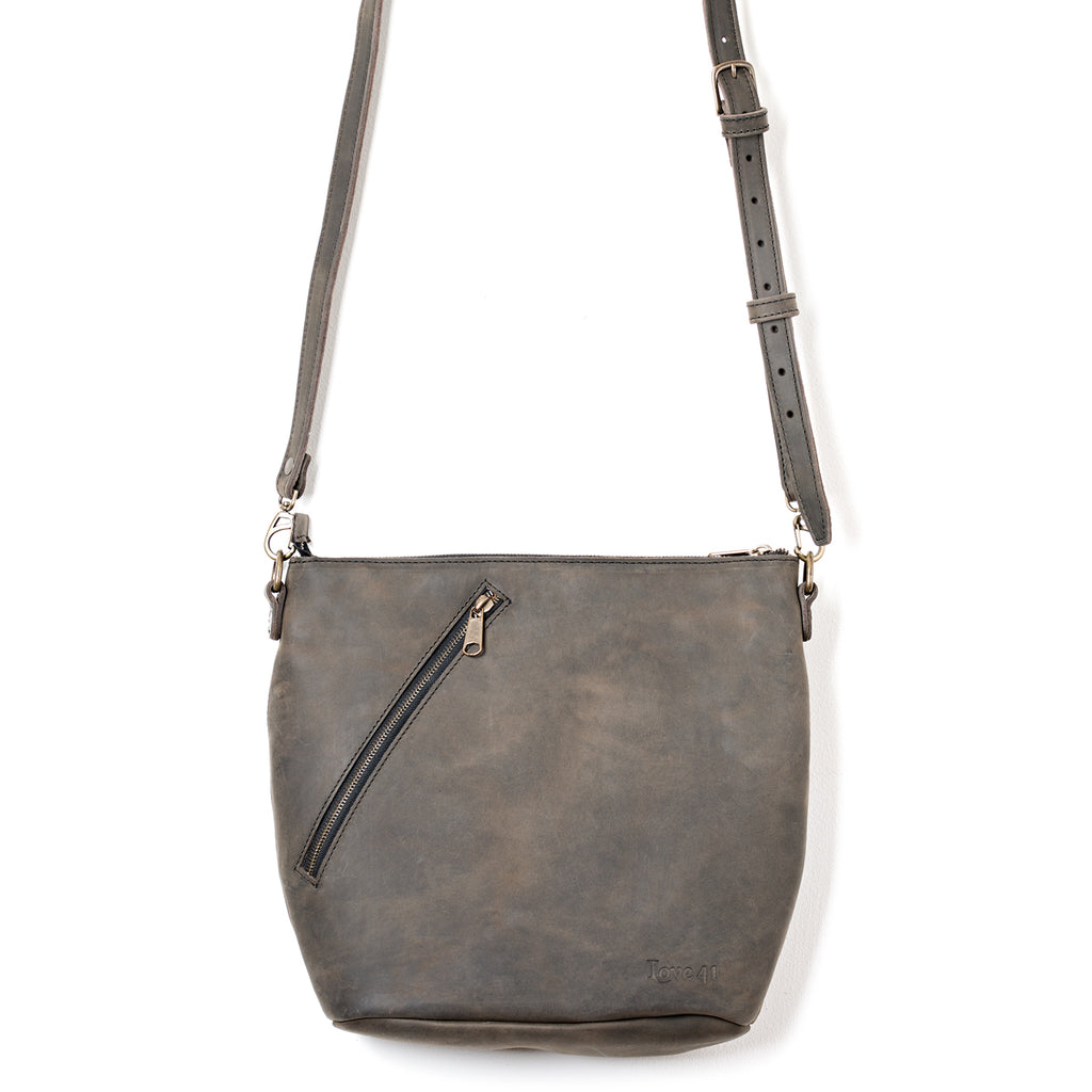 Crossbody Concealed Leather Bag in Black with weathered gray finish, front view with diagonal zipper