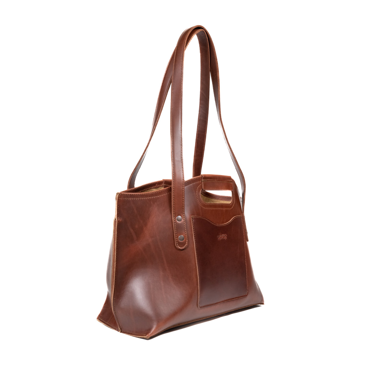 Urban Leather Tote in Chestnut, angled side view with shoulder handles, cutout grip and front slip pocket