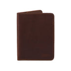 Slim Passport Wallet in Chestnut standing closed, front view with embossed logo