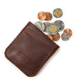Bear Trap Leather Coin Purse in Chestnut with coins spilling out and embossed Saddleback Leather Co. logo
