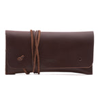 Cash & Receipt Bag in Chestnut, closed flap with wrapped leather tie and embossed logo, front view