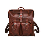 Big Mouth Leather Backpack in Chestnut, front view with buckled pockets and top handle