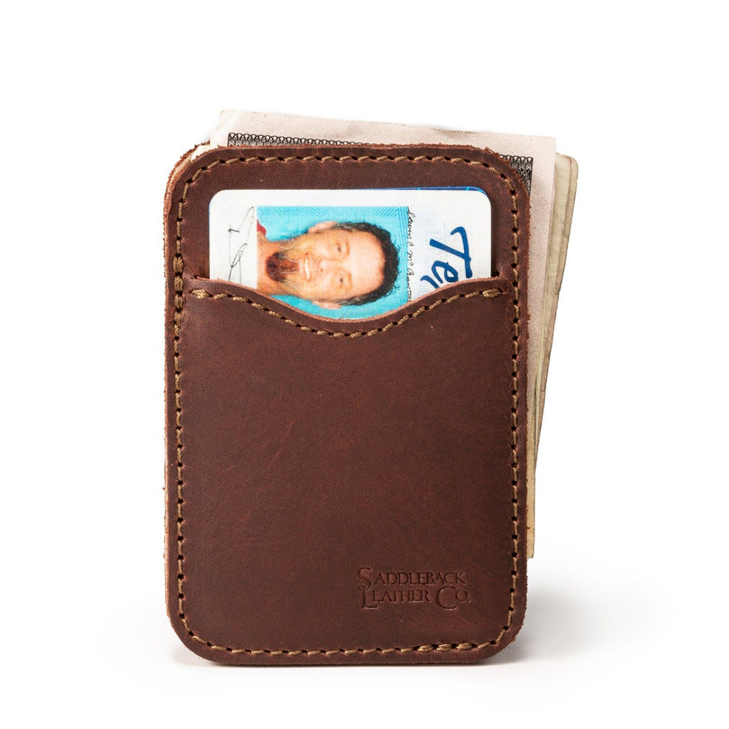 Slim Leather Card Wallet in Chestnut with an ID card in the front pocket and folded cash behind