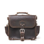 Photographer's Satchel in Dark Coffee Brown, front view with buckled flap, top handle and side pockets