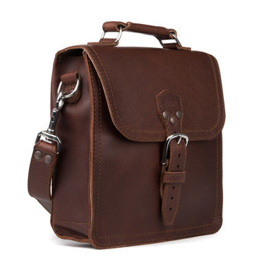 Indiana Leather Satchel in Chestnut, angled front view with buckled flap, top handle and shoulder strap