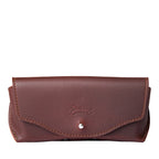 Leather Sunglass Case in Chestnut, closed front view with flap, snap closure and embossed logo