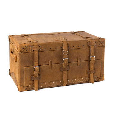 Leather Trunk in Tobacco, closed front view with buckled straps, studded trim and leather corner guards
