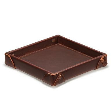 The Leather Grandfather Valet Tray in Chestnut, empty, angled view with riveted corner tabs