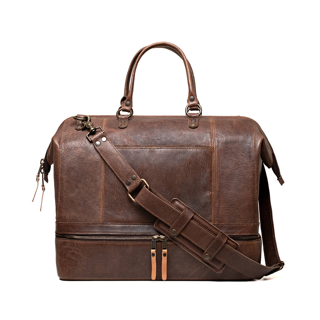 Two Compartment Duffle in Dark Coffee Brown, front view with top handles, shoulder strap and zippered bottom compartment
