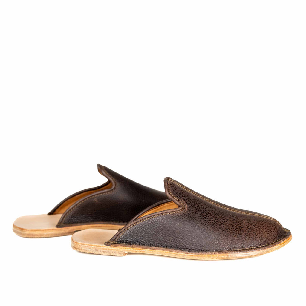Pair of Barefoot Slip-on Mules in Dark Coffee Brown leather with open backs and natural soles, side view
