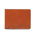 William Penn Bifold Wallet in English Tan, closed front view with debossed Saddleback Leather Co. logo