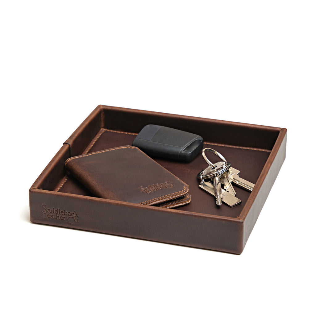 The Simple Leather Valet Tray in Dark Coffee Brown holding a leather card wallet, key fob and keys, angled view