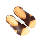 Pair of Jesus Sandals in Chestnut leather with crisscross straps and tan footbeds, top-down view