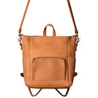 Universal Leather Backpack in Tobacco, front view with crossbody shoulder strap attached