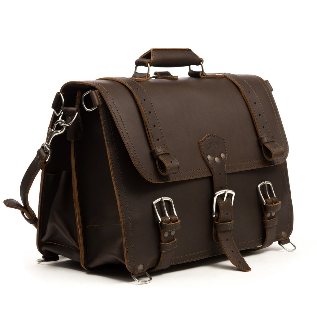 Large Classic Leather Briefcase in Dark Coffee Brown, angled side view with buckled flap straps and side pocket