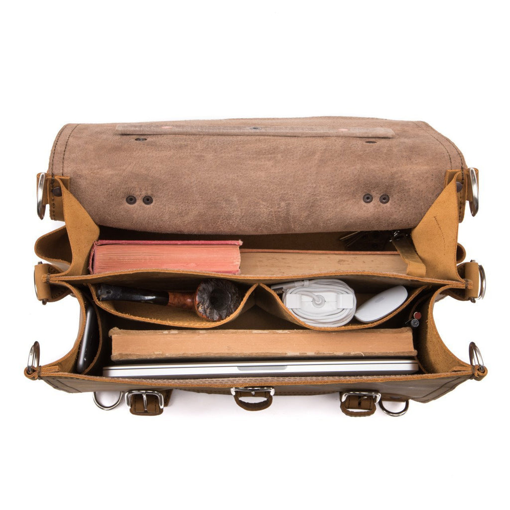 Large Classic Leather Briefcase in Tobacco, top view open with a book, pipe, cable, mouse and laptop in its pockets