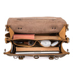 Large Classic Leather Briefcase in Tobacco, top view open with a book, pipe, cable, mouse and laptop in its pockets