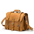 Large Classic Leather Briefcase in Tobacco, angled side view with buckled flap straps, side pocket and shoulder strap