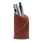 Pen Cup in Chestnut leather with diagonal stitched wrap and embossed Saddleback Leather logo, holding pens