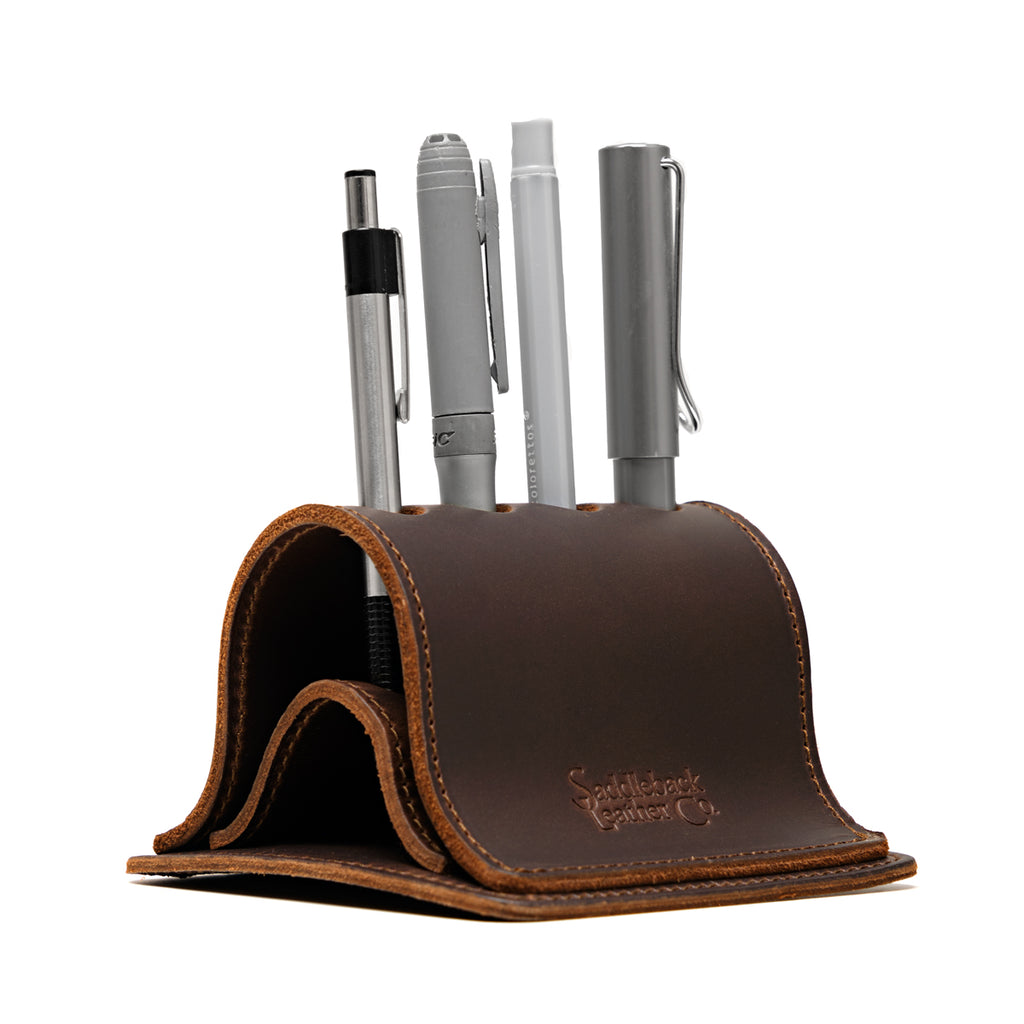 Pen Holder Bell Curve in Dark Coffee Brown leather, front view holding four pens with embossed Saddleback Leather Co. logo