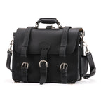 Large Classic Leather Briefcase in Black, front view with buckled flap straps, front pockets and shoulder strap
