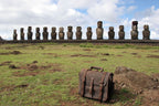 Large Classic Leather Briefcase in Dark Coffee Brown on a grassy field before a row of Easter Island moai statues