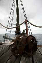 Large Classic Leather Briefcase in Chestnut on the wooden deck of a tall sailing ship at sea