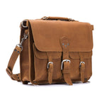 Thin Front Pocket Leather Briefcase in Tobacco, angled front view with two buckled front pockets and shoulder strap
