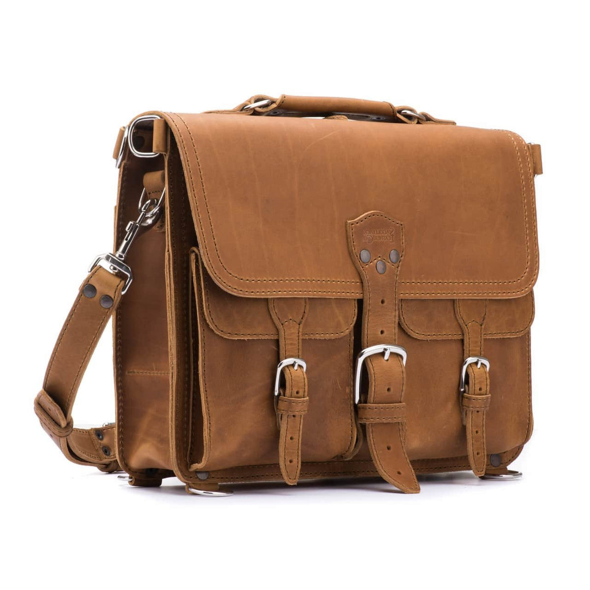 Thin Front Pocket Leather Briefcase in Tobacco, angled front view with two buckled front pockets and shoulder strap