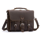 Thin Front Pocket Leather Briefcase in Dark Coffee Brown, front view with two buckled front pockets and shoulder strap