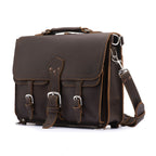 Thin Front Pocket Leather Briefcase in Dark Coffee Brown, angled front view with two buckled front pockets and strap