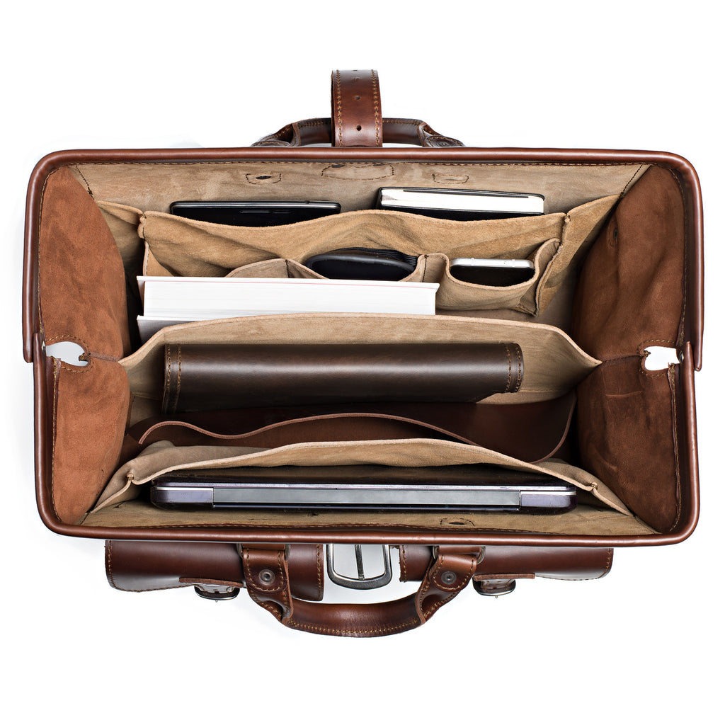 Barrister's Briefcase in Chestnut, top view open and packed with a laptop, notebook, phone and leather case