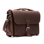 Slim Leather Briefcase in Chestnut, angled front view with buckled flap, top handle and shoulder strap