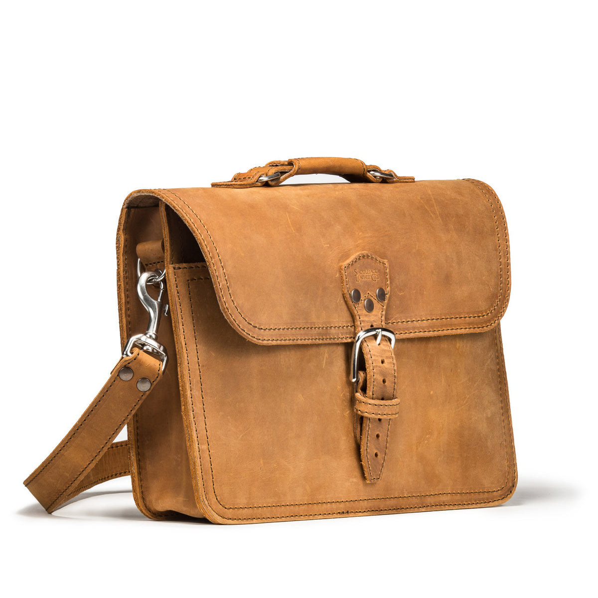 Fourteener Thin Leather Briefcase in Tobacco, angled front view with top handle, buckled flap and shoulder strap