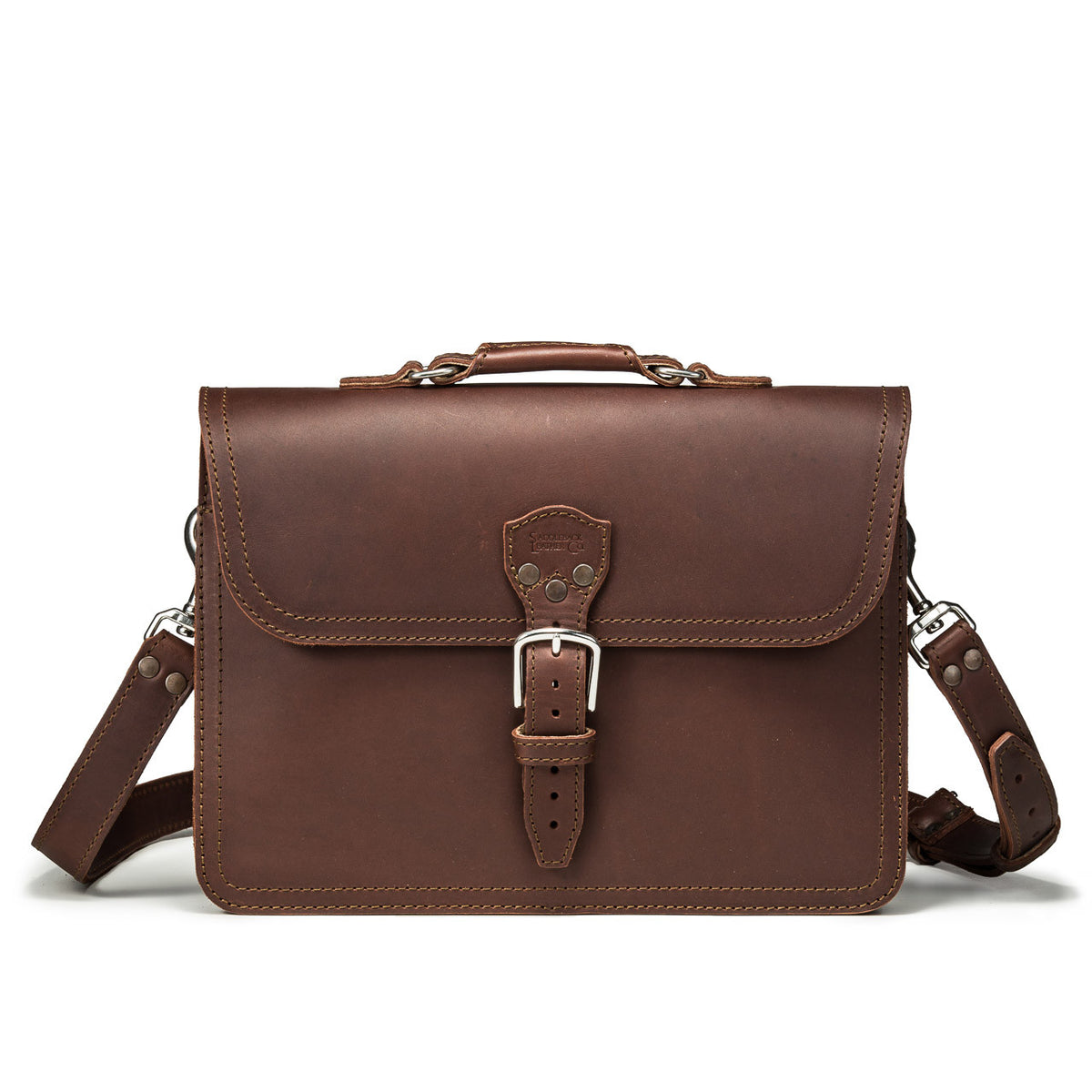 Fourteener Thin Leather Briefcase in Chestnut, front view with top handle, buckled flap and shoulder strap