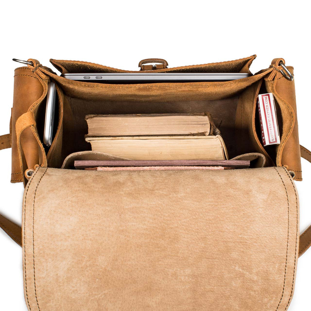 Tank Backpack in Tobacco, top view open with a laptop, books and a phone inside