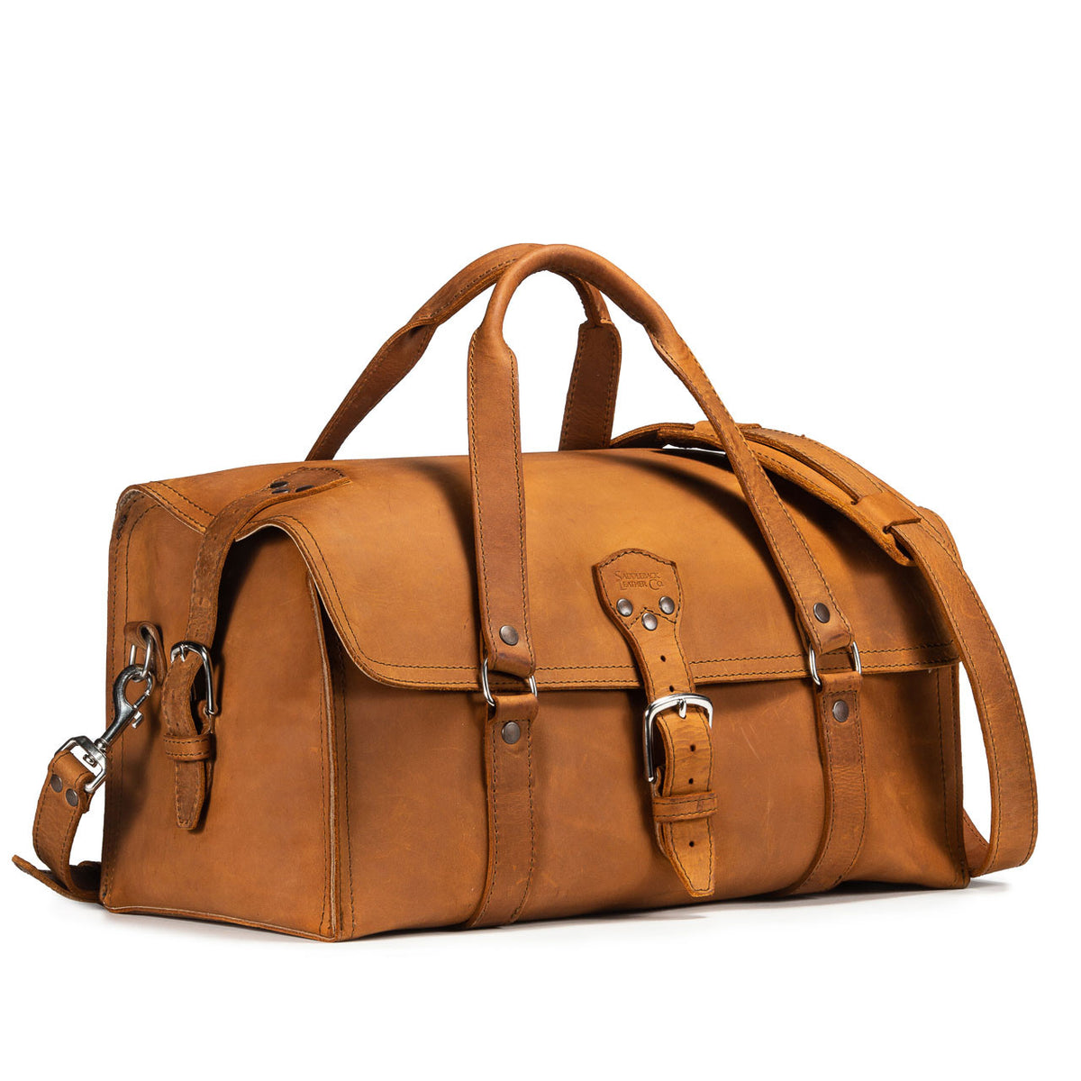 20" Baby Beast Duffle Bag in Tobacco, angled front view with buckle straps and shoulder strap