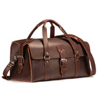 20" Baby Beast Duffle Bag in Chestnut, angled front view with buckle straps and shoulder strap