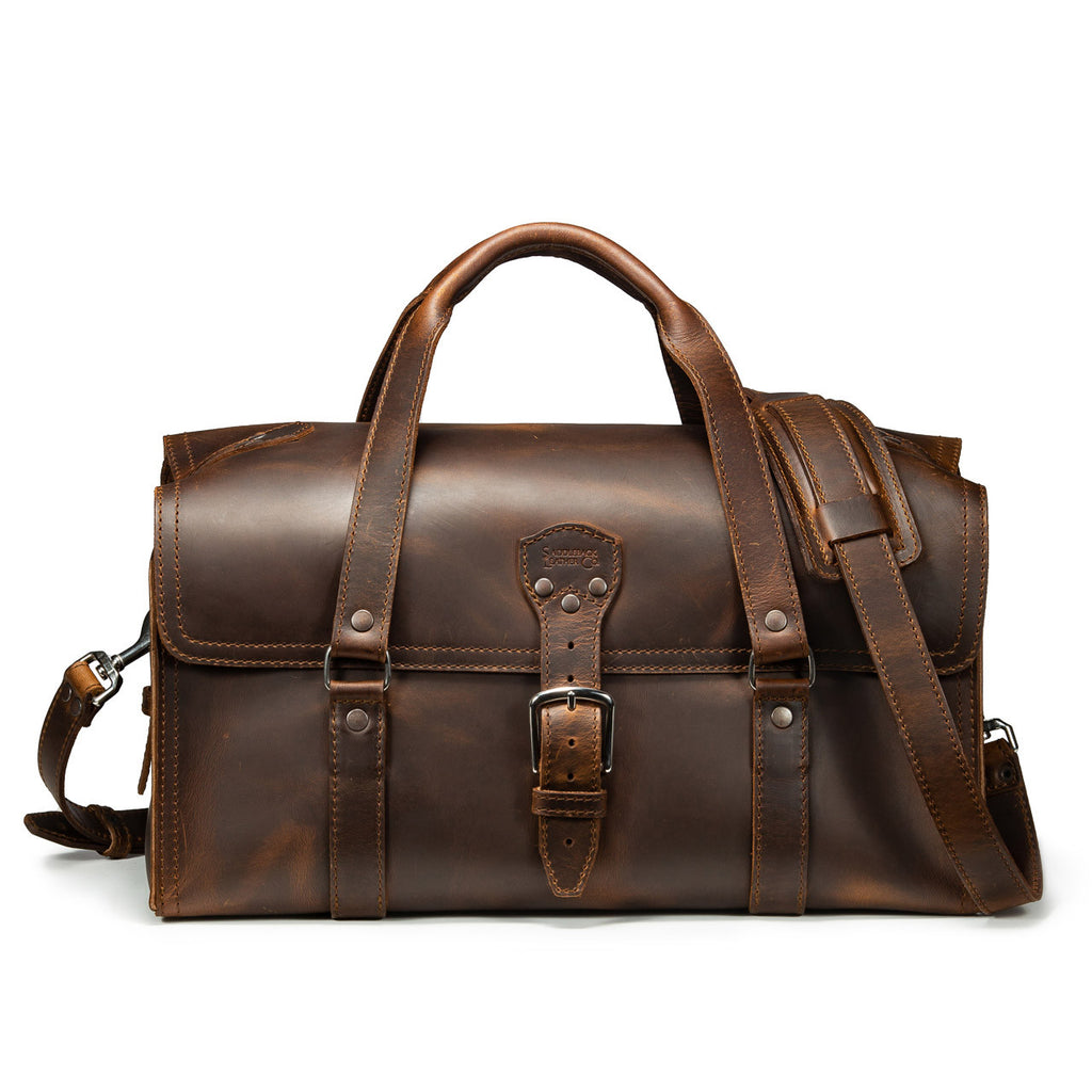 20" Baby Beast Duffle Bag in Dark Coffee Brown, front view with center buckle strap and shoulder strap