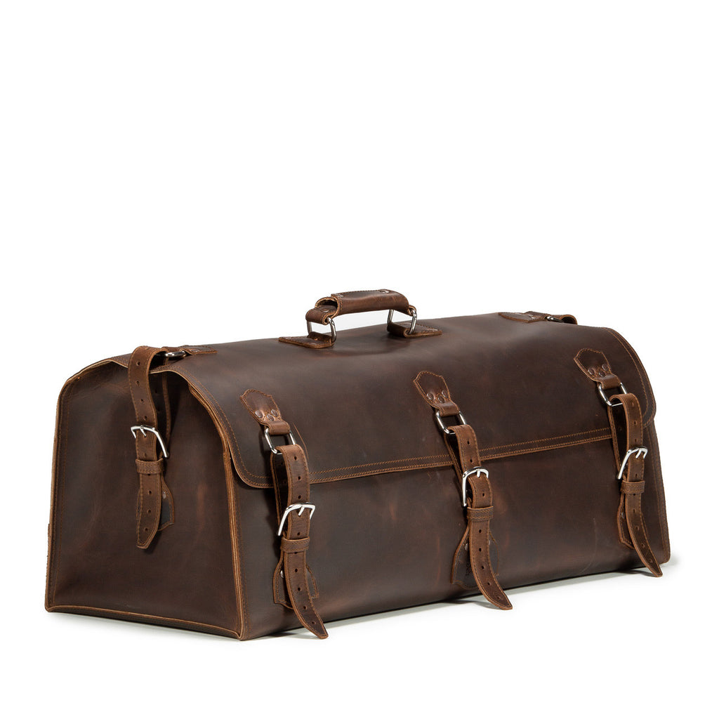 34" Beast Duffle Bag in Dark Coffee Brown, angled front view with three buckle straps and top handle