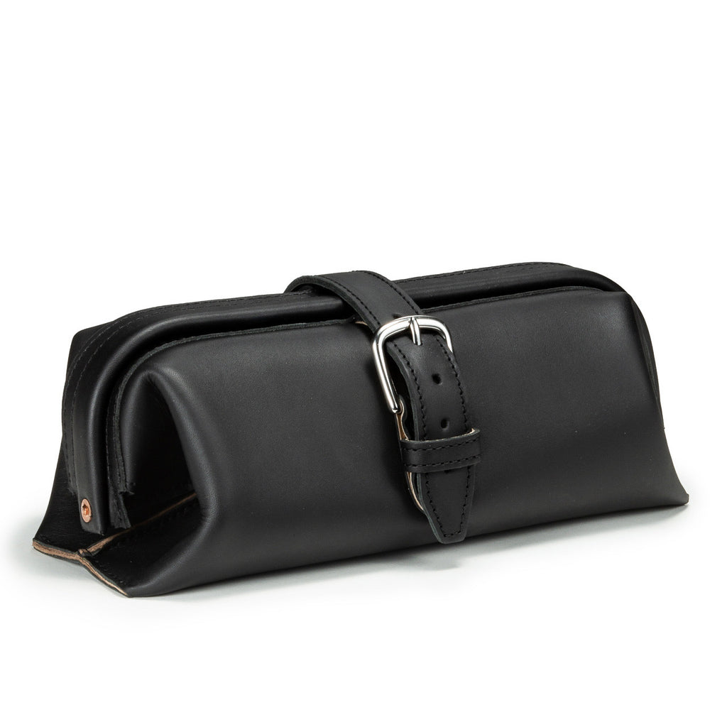 Little Big Mouth Toiletry Bag in Black, angled front view with wide frame opening and buckled strap closure