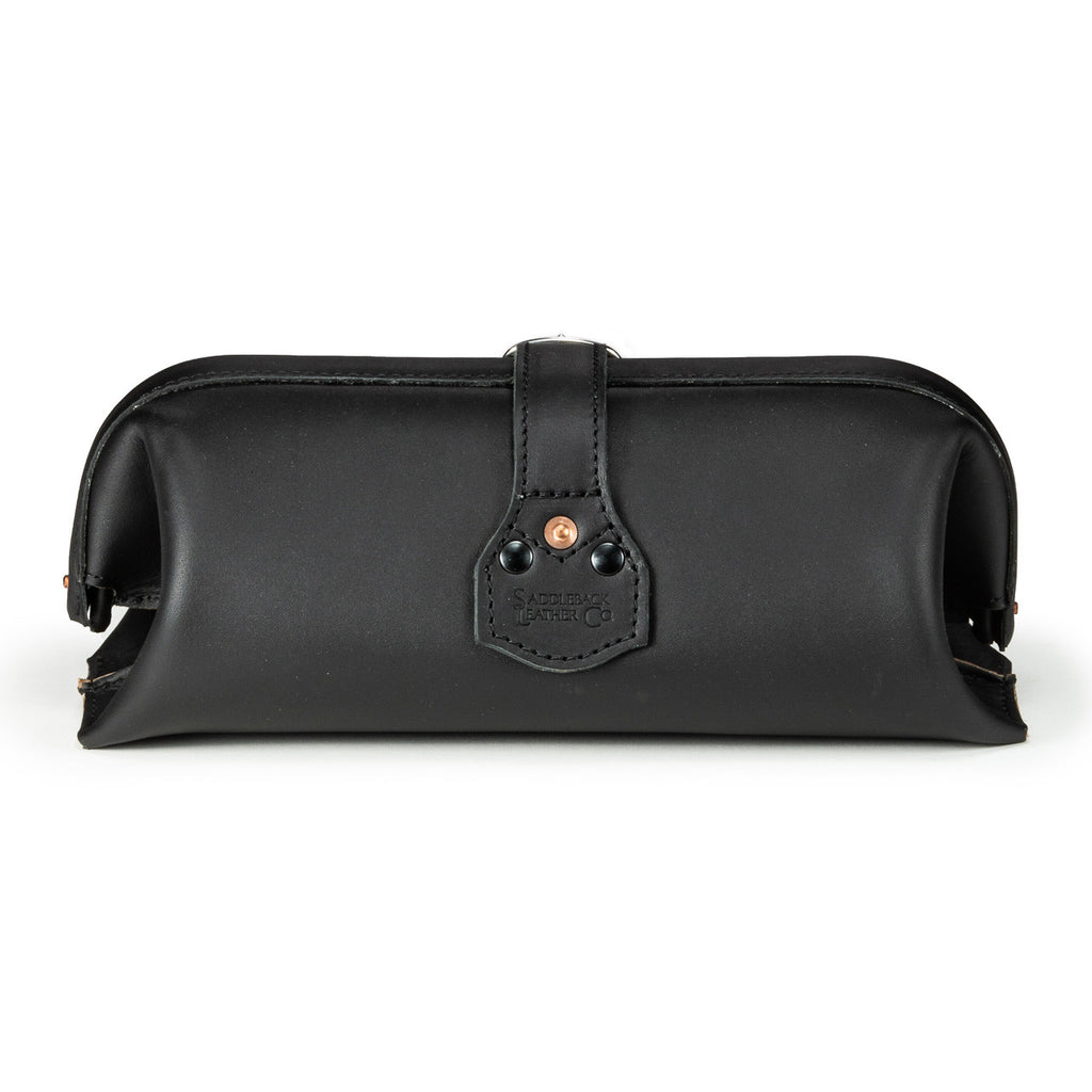 Little Big Mouth Toiletry Bag in Black, back view with riveted strap tab and embossed logo