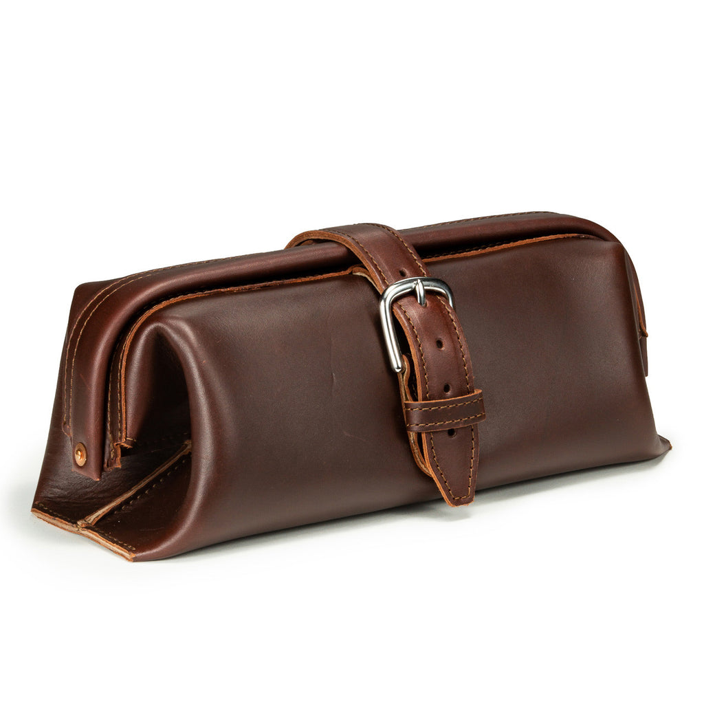Little Big Mouth Toiletry Bag in Chestnut, angled front view with wide frame opening and buckled strap closure