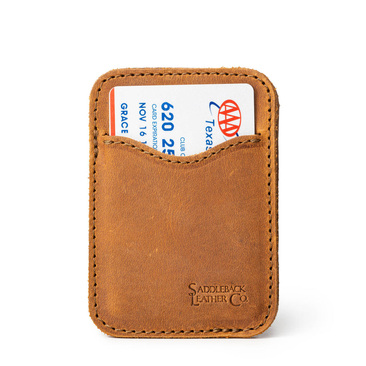 Slim Leather Card Wallet in Tobacco, front view with a card tucked in the curved front pocket